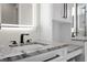 Close-up of a bathroom sink with granite countertop and modern fixtures at 2058 Washington Ave, Sanford, FL 32771