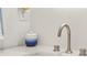 Stylish bathroom sink featuring a modern faucet, clean countertop, and decorative ceramic jar at 2058 Washington Ave, Sanford, FL 32771