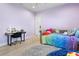 Cozy bedroom featuring a desk, daybed with bright bedding, and a soft rug at 2058 Washington Ave, Sanford, FL 32771