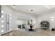 Bright dining area showcasing modern light fixture, stylish decor, and an expansive window offering scenic views at 2058 Washington Ave, Sanford, FL 32771