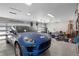 Clean, organized garage space featuring ample storage and a blue Porsche Macan at 2058 Washington Ave, Sanford, FL 32771