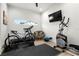 Home gym features treadmill, bike, elliptical and wall-mounted TV for convenient workouts at 2058 Washington Ave, Sanford, FL 32771