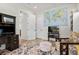 Another view of the office showcasing the desk, seating area, and open doorway at 2058 Washington Ave, Sanford, FL 32771