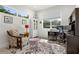 Bright home office featuring natural light, a comfortable chair, modern desk, and stylish decor at 2058 Washington Ave, Sanford, FL 32771