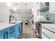 Stylish kitchen with blue island, stainless steel appliances, and modern fixtures at 2058 Washington Ave, Sanford, FL 32771