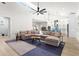 Open concept living room leading to the kitchen featuring a large sectional sofa and a high ceiling at 2058 Washington Ave, Sanford, FL 32771
