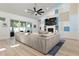 Spacious living room with high ceiling, fireplace and a large sofa at 2058 Washington Ave, Sanford, FL 32771