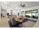Open concept living room leading to the kitchen with sliding glass doors to the backyard at 2058 Washington Ave, Sanford, FL 32771