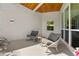 Relaxing outdoor seating area features comfortable chairs, modern lighting, and views of the surrounding greenery at 2058 Washington Ave, Sanford, FL 32771