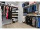 Spacious walk-in closet with custom shelving, hanging racks, and ample storage space for clothes and accessories at 2058 Washington Ave, Sanford, FL 32771