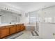 Large Primary bathroom boasts double sinks, soaking tub and glass enclosed shower stall at 229 Troon Cir, Davenport, FL 33897