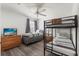 This bedroom features one twin sized bed plus a bunk bed for extra sleeping capacity at 229 Troon Cir, Davenport, FL 33897