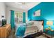 Bright bedroom featuring a comfy queen bed, and a flat screen TV for easy viewing at 229 Troon Cir, Davenport, FL 33897