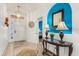 Welcoming entryway features tile flooring, decorative lighting, and a stylish console table at 229 Troon Cir, Davenport, FL 33897