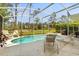 Relaxing backyard pool and patio area is perfect for entertaining or unwinding in the sun at 229 Troon Cir, Davenport, FL 33897