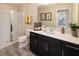 Bright bathroom featuring a glass-enclosed shower, a modern vanity, and neutral wall tones at 2327 Distant Sun Trl, Kissimmee, FL 34747