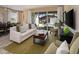 Living area with furniture, rug, and decor, leading to the dining area and outdoor pool at 2327 Distant Sun Trl, Kissimmee, FL 34747