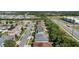 Aerial view captures a suburban neighborhood streetscape with various home exteriors and landscaping at 2501 Hinsdale Dr, Kissimmee, FL 34741
