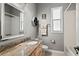 Bathroom featuring granite countertops, a large mirror, and a shower-tub combination in a well-lit area at 2501 Hinsdale Dr, Kissimmee, FL 34741