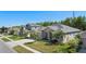 Exterior view displays houses featuring well-kept lawns, palm trees, and manicured landscaping at 2501 Hinsdale Dr, Kissimmee, FL 34741