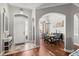 Elegant foyer with hardwood floors seamlessly transitioning into a dining area, enhanced by natural light at 2501 Hinsdale Dr, Kissimmee, FL 34741