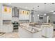 Modern kitchen features granite countertops, white cabinets, subway backsplash and stainless appliances at 2501 Hinsdale Dr, Kissimmee, FL 34741