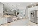 Spacious kitchen with granite countertops, stainless appliances, and a large island with seating at 2501 Hinsdale Dr, Kissimmee, FL 34741