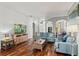 Bright living room with hardwood floors, neutral walls, lots of natural light, open to other living areas at 2501 Hinsdale Dr, Kissimmee, FL 34741