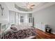 Spacious main bedroom with hardwood floors, ceiling fan, and lots of natural light at 2501 Hinsdale Dr, Kissimmee, FL 34741