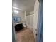 Well-lit bathroom featuring a black vanity, tile floors, and a shower with a clear curtain at 2717 Maitland Crossing Way # 4-103, Orlando, FL 32810