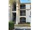 Condo building featuring a stairway to the units and screened in balconies at 2717 Maitland Crossing Way # 4-103, Orlando, FL 32810