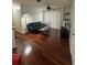 Inviting living room with hardwood floors, modern lighting, and a sliding glass door to balcony at 2717 Maitland Crossing Way # 4-103, Orlando, FL 32810
