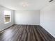 Empty bedroom featuring hardwood flooring, neutral walls, a window, and ample natural light at 3056 Sangria St, Kissimmee, FL 34744