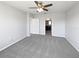 View of bedroom with ensuite bathroom, and neutral walls with neutral carpet at 3056 Sangria St, Kissimmee, FL 34744