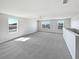 Spacious bonus room with ample natural light, carpet flooring, and ceiling fan at 3056 Sangria St, Kissimmee, FL 34744