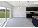 Dining area features sliding glass door leading to the backyard and dark wood cabinetry at 3056 Sangria St, Kissimmee, FL 34744