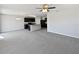 Open-concept living room adjacent to the kitchen, perfect for entertaining guests and Gathering at 3056 Sangria St, Kissimmee, FL 34744