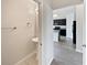 View through doorway into the downstairs powder room with pedestal sink and chrome fixtures at 3056 Sangria St, Kissimmee, FL 34744