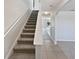 View of the carpeted staircase leading to the second floor of this well-maintained home at 3056 Sangria St, Kissimmee, FL 34744