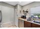 Functional kitchen area with stainless steel appliances and ample counter space for food preparation at 312 Carina Cir, Sanford, FL 32773