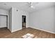 Bedroom with wood floors featuring access to an en suite bathroom and closet at 3398 Greenwich Village Blvd # 104, Orlando, FL 32835