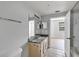 Bathroom featuring a sink, toilet, and large mirror with shower at 3398 Greenwich Village Blvd # 104, Orlando, FL 32835