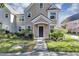 Charming front door entrance with a well-manicured lawn and inviting walkway to the home at 3398 Greenwich Village Blvd # 104, Orlando, FL 32835