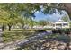 Community green space featuring lush grass and a gazebo to create a tranquil outdoor space at 3398 Greenwich Village Blvd # 104, Orlando, FL 32835