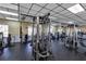 The on-site gym features modern weight machines, neutral wall paint, and rubber flooring at 3398 Greenwich Village Blvd # 104, Orlando, FL 32835
