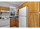 Functional kitchen features a refrigerator and an electric range at 3398 Greenwich Village Blvd # 104, Orlando, FL 32835