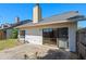 Backyard with a concrete patio, gray roof, light exterior, and a partial fence, perfect for outdoor enjoyment at 3605 S Saint Lucie Dr, Casselberry, FL 32707