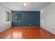 Bedroom featuring wood floors and window with a view of the exterior at 3605 S Saint Lucie Dr, Casselberry, FL 32707