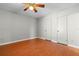Bedroom featuring wood floors and two large closets at 3605 S Saint Lucie Dr, Casselberry, FL 32707