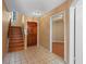 Inviting entryway with tile floors and a staircase to the second floor at 3605 S Saint Lucie Dr, Casselberry, FL 32707